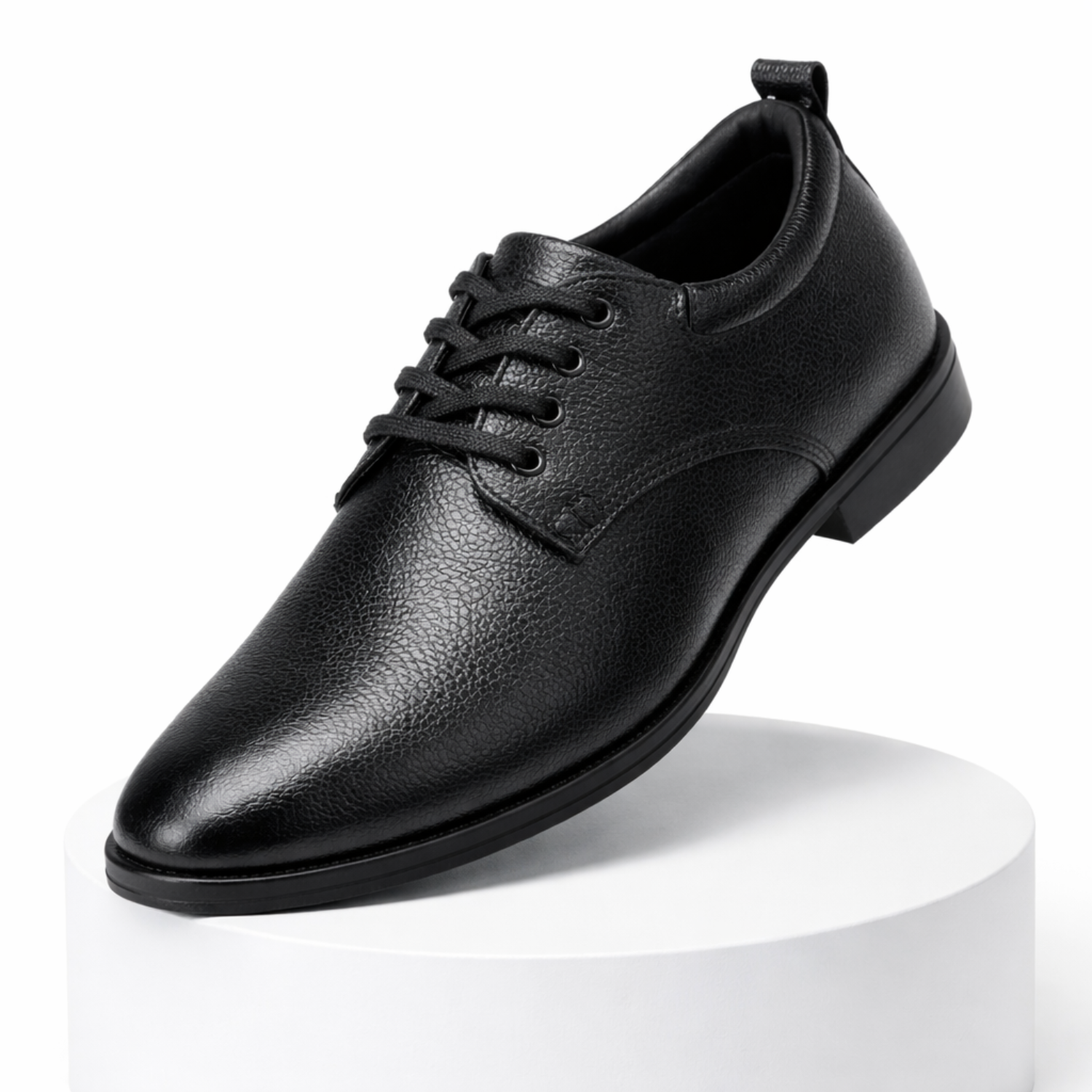Single black textured leather lace-up formal shoe with closed lacing displayed on a white podium