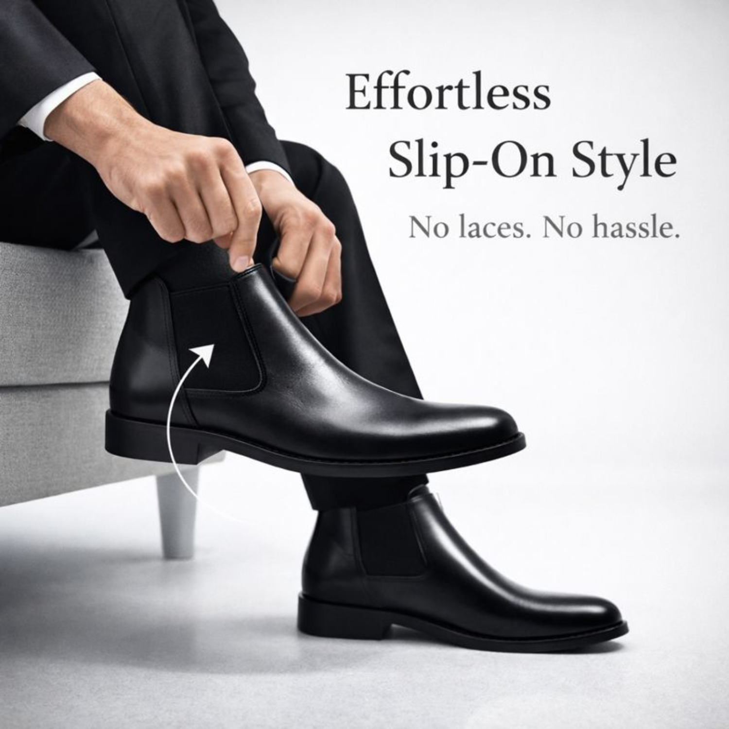 Man wearing black leather Chelsea boots with elastic side panels, demonstrating easy slip-on style without laces.