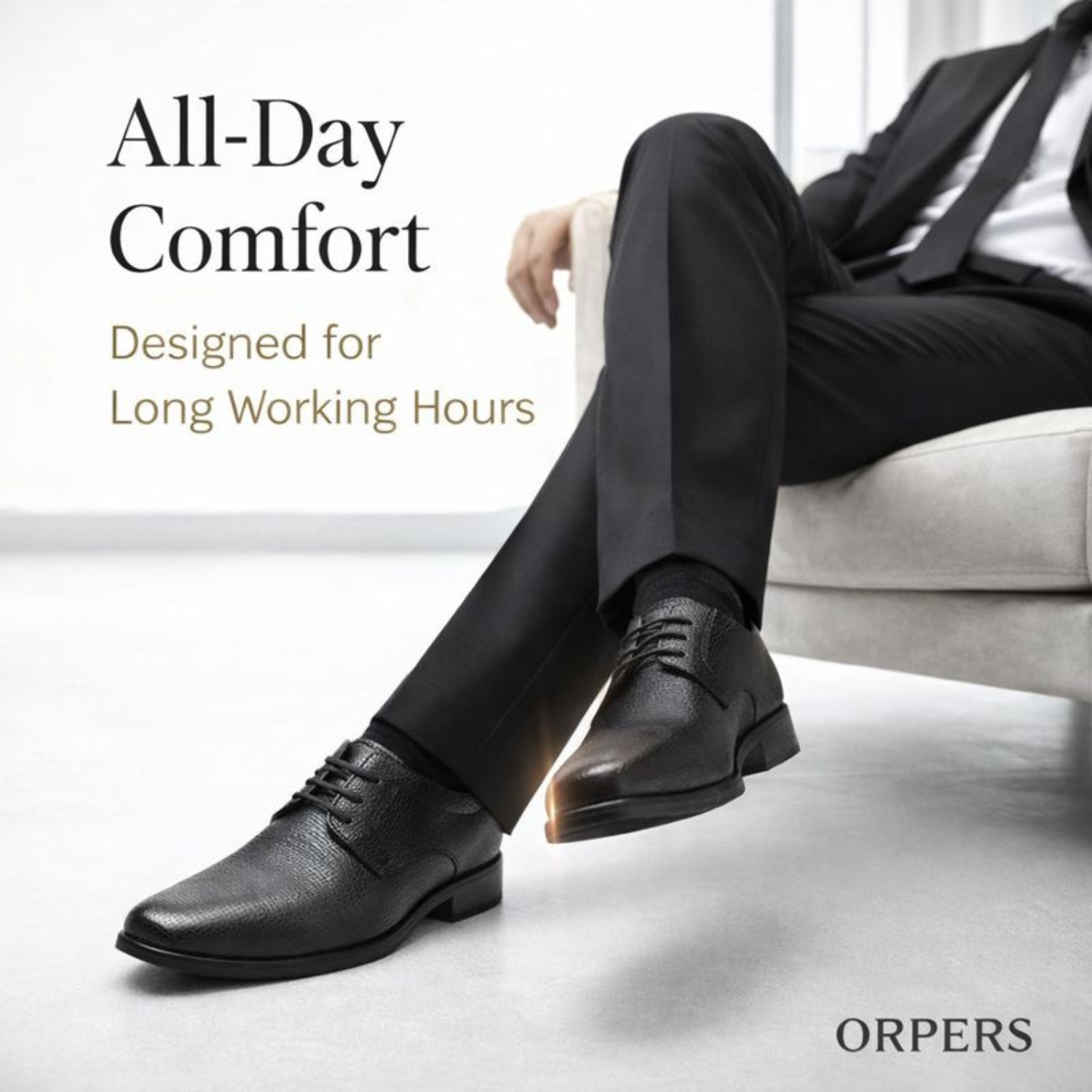 Man wearing ORPERS black textured leather formal lace-up shoes while seated, highlighting all-day comfort design for long working hours.