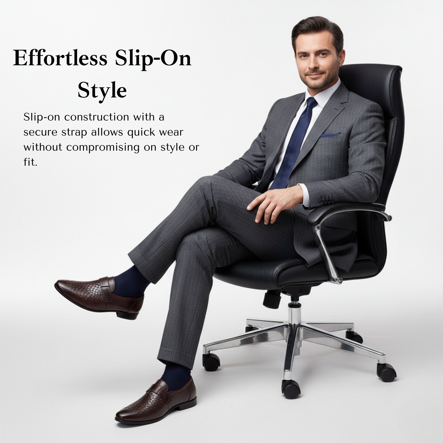 Man in a grey formal suit sitting on an office chair wearing brown woven leather slip-on loafers